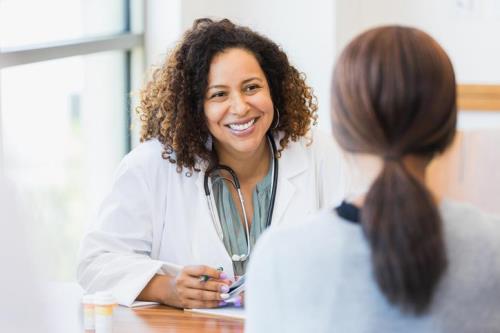 Woman speaks with her doctor about urinary tract infection testing options
