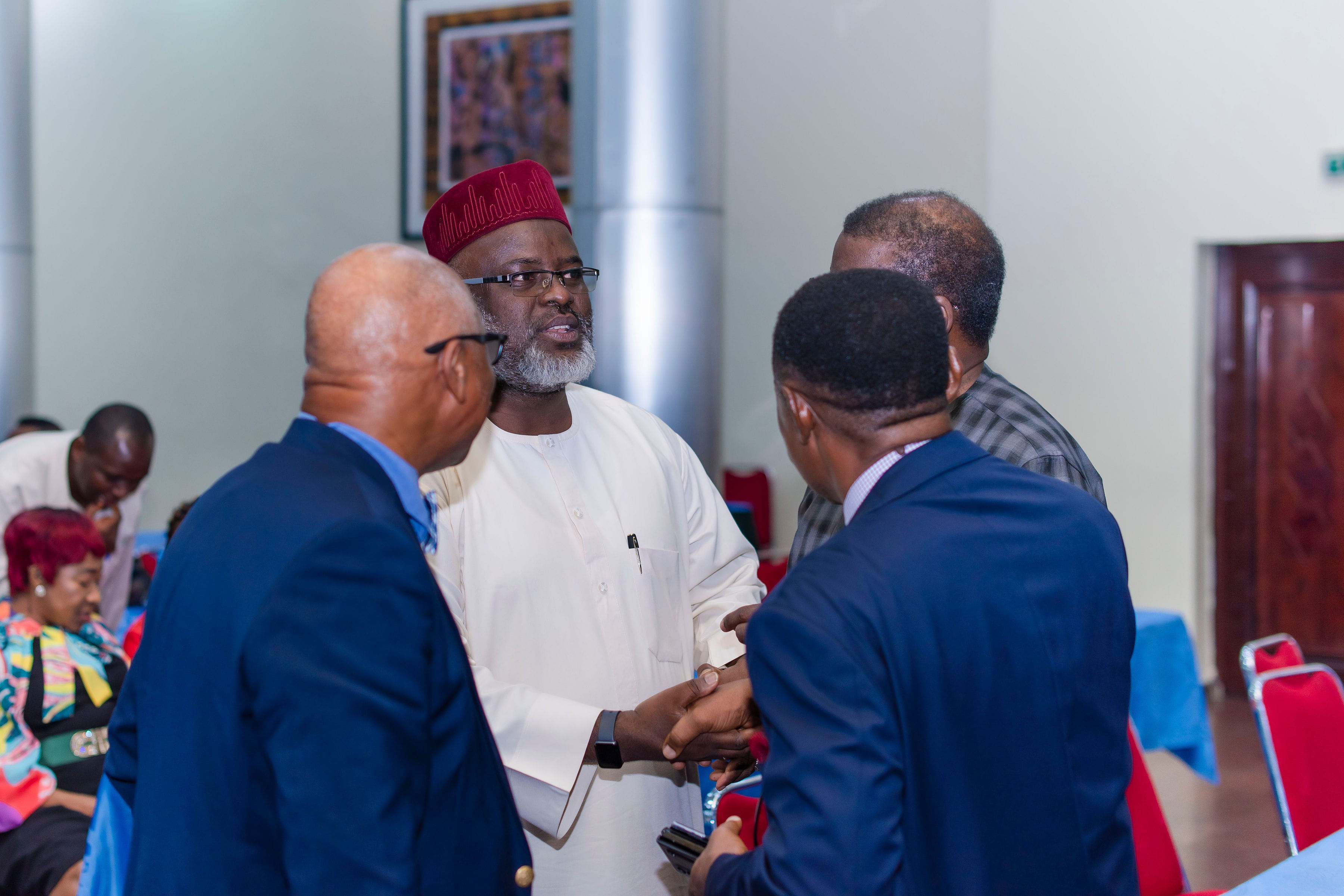 Professor Saleh Yuguda, MBBS, FMCPath, shaking hands with participants at the ADLM/ACCN/Academy of Medical Sciences of Nigeria event