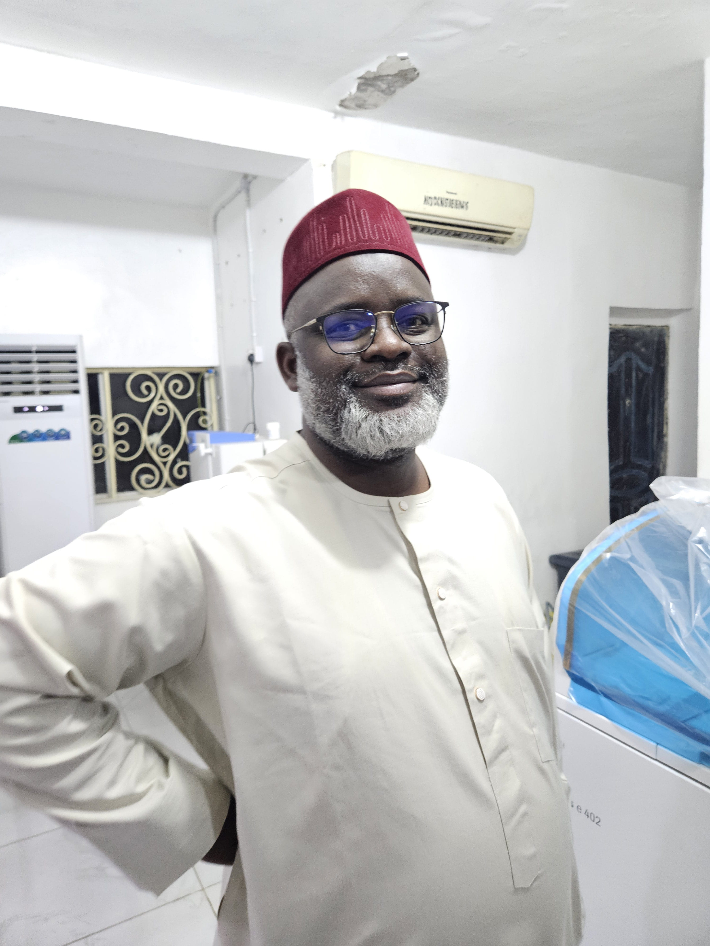 Professor Yuguda, MBBS, FMCPath, posing for a picture at a laboratory