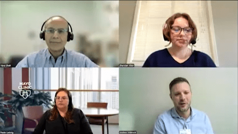 group of speakers on a panel discussion