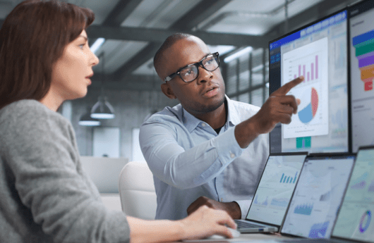 Data Science Symposium: Two people on computer