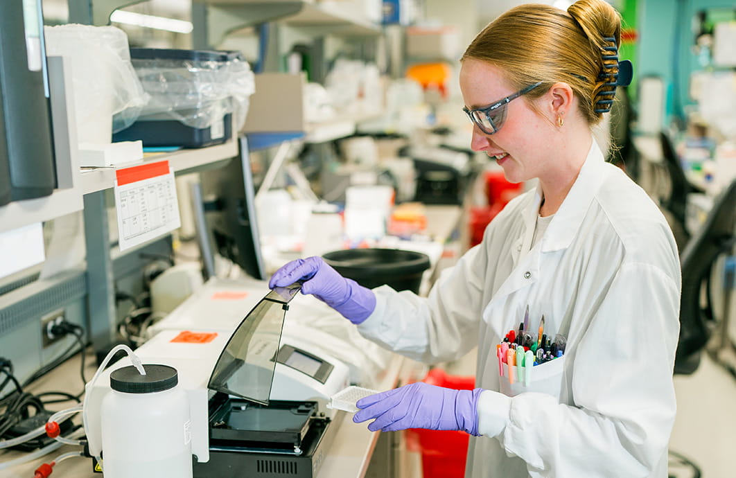 Female lab technician working with equipment