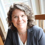Heidi Rehm sitting in front of window
