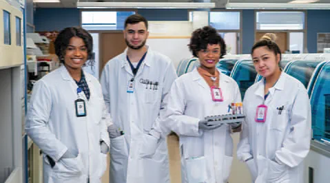 A group of four laboratorians