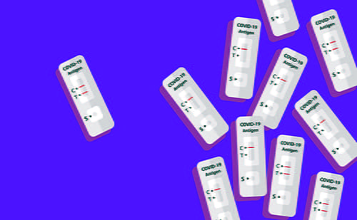 Multiple at-home COVID-19 tests in front of a purple background