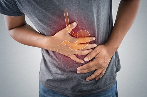 A man placing his hands over his stomach
