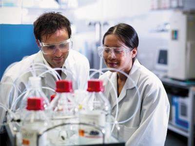 laboratorians at mass spectrometer
